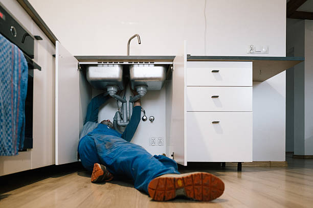 Professional Drain Cleaning technician working in Long Island City, NY